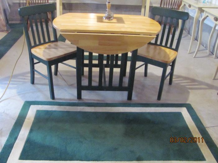 round drop leaf butcher block table and 2 chairs