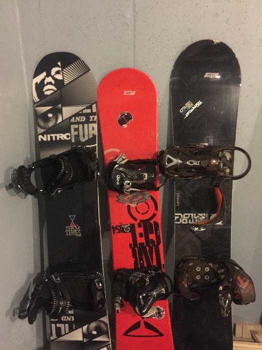Snowboards and bindings.  Nitro board/bindings on left good for large feet (sz 12+).  Board on right is broken, but bindings are in great shape.