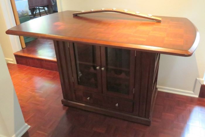 Fabulous "Wine Table" with lots of storage.  Its also on casters so you can roll it wherever you are!