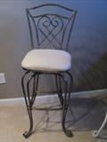 1 of 2 Ornate Iron Bar Stools with swivel seats