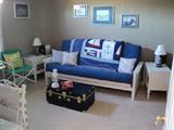 Adirondack style Futon Sofa Sleeper pictured also nautical themed blanket/throw, travel trunk, matching lamps, wall prints and more