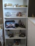 Bookcase with lighthouses, cigar boxes, etc.