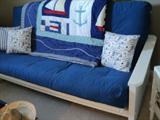 Closer view of Futon and Nautical blanket or throw