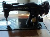 Antique Singer Sewing Machine with nice floor model cabinet