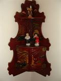 Corner Oriental shelf with vintage oriental figurenes