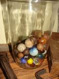Jar of marbles, many clay marbles