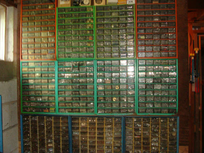 Wall of organizers all full of nuts, bolts, etc.