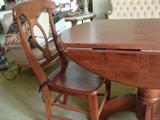 Beautiful antique solid wood (cherry?) drop leaf table and matching pair of high back chairs