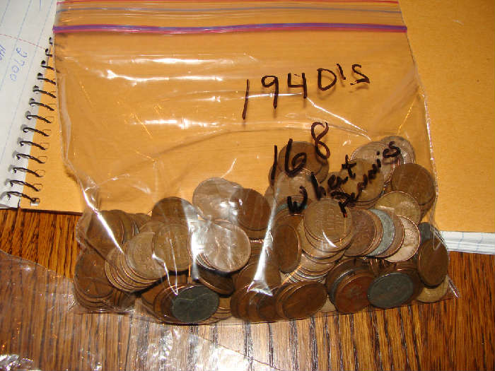1940's Wheat Pennies over 100. We found these in a small glass piggy bank; the only way to get them out was to literally bust the bank!