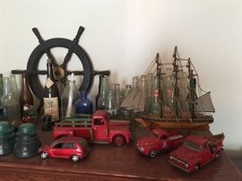 Vintage glass bottles, toy cars
