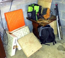 Baseball gloves, balls, bases, bats