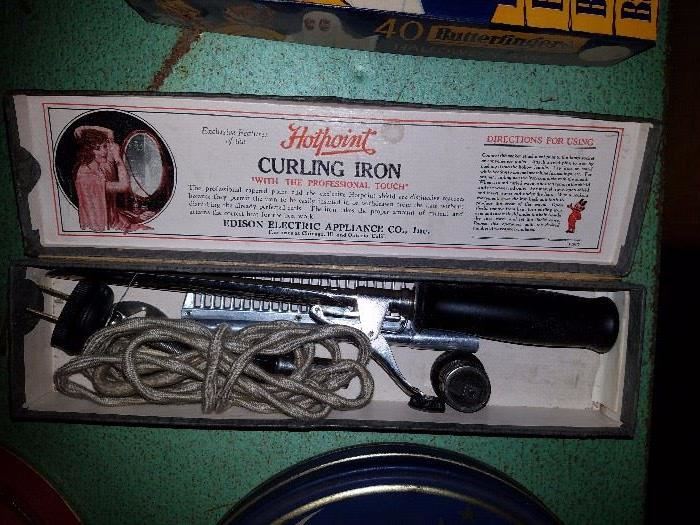 Old curling iron in box