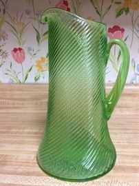 Federal Glass Green Vaseline / Uranium (tested) optic reverse swirl pitcher.  10" high and the base is 5 3/4" wide.