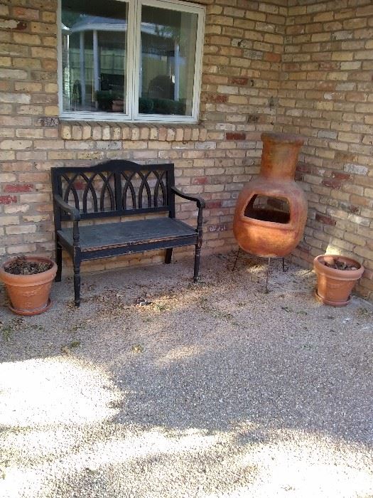 Vintage wooden outside bench with Blanchard's and outside fireplace