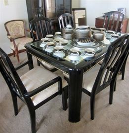 Modern dining table (damage on foot of one table leg)