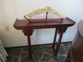 Asian motif table with carved (resin) decoration in the style of carved ivory pieces