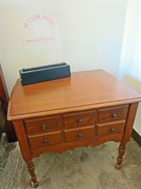 Night stand and "Sutter House" advertising decoration