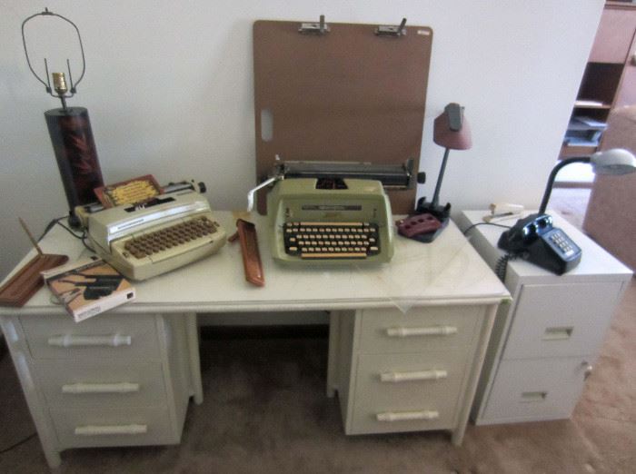 Vintage desk, typewriters, Asian lamp (sans shade), slide rule, etc