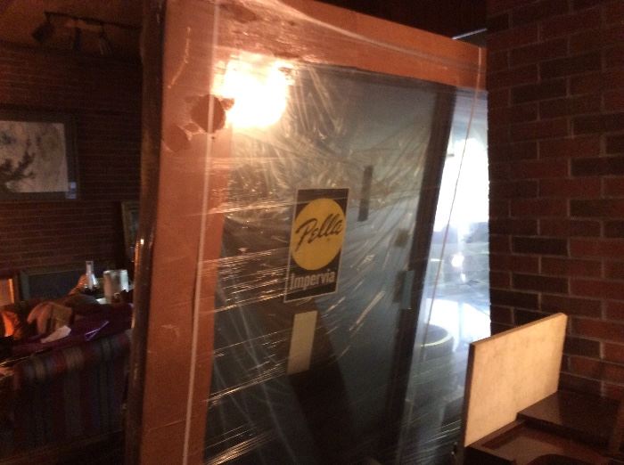 Brand new Pella sliding glass patio door. Never out of shipping material