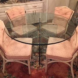  Very nice round kitchen table and four chairs peach color. Large glass table top with Glass base