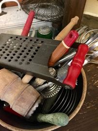 Lots of red handles on kitchen tools 