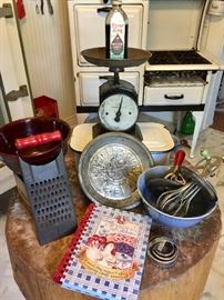Old scales, butcher block, vintage green and red handled kitchen tools, enamel refrigerator bin 