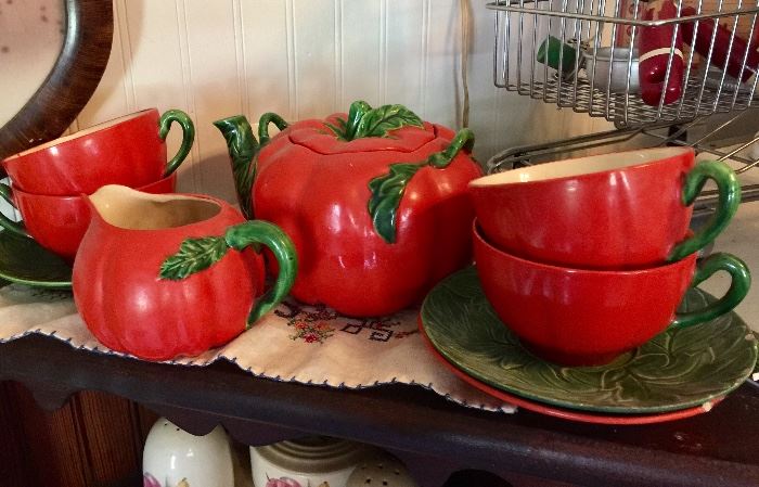 Tomato teapot and creamer with cups and saucers