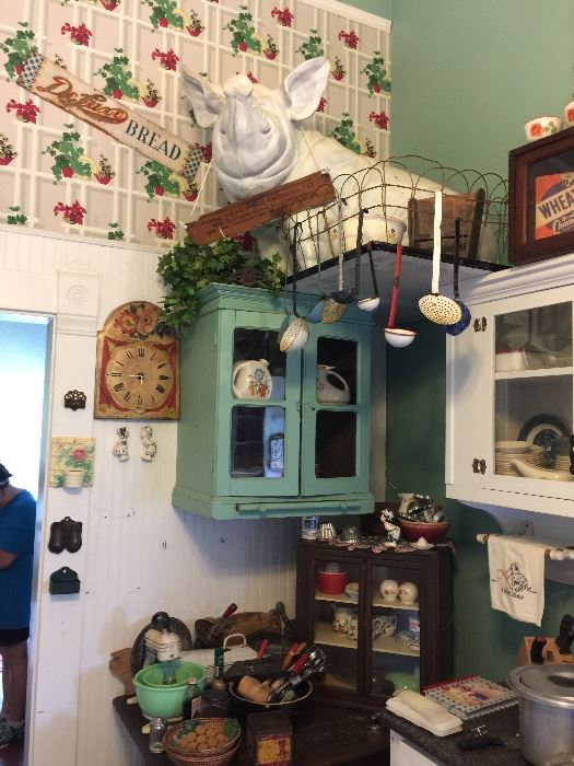 Kitchen full of authentic decor, appliances from late 1800's to 1940's