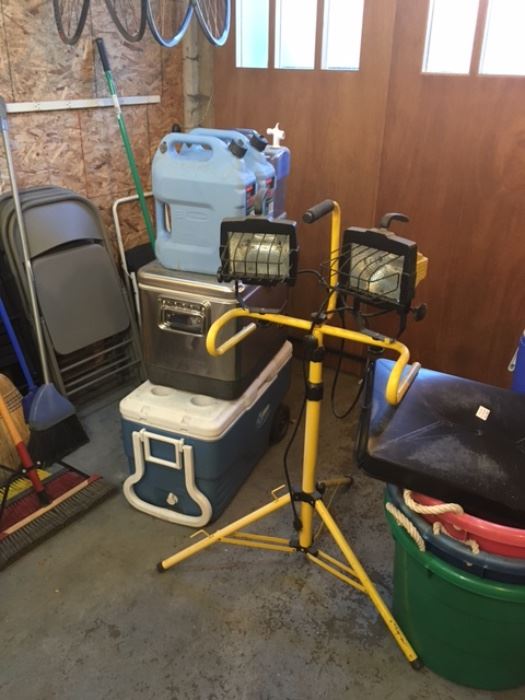 Work lights, coolers, folding chairs, water cans.
