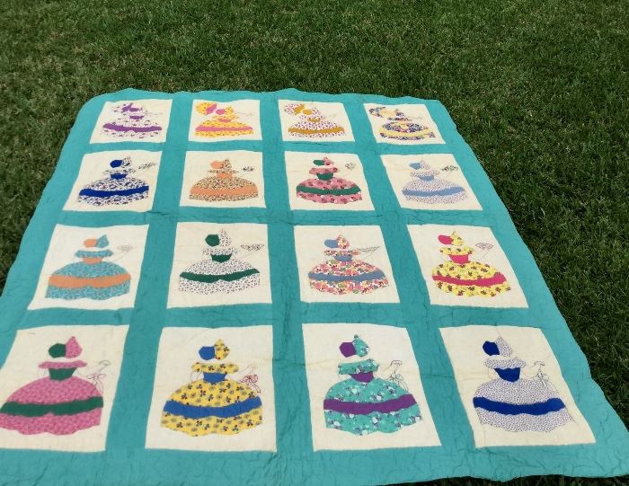 Old quilt all hand stitched.  Southern ladies with fans, parasols, flowers appliqued and embroidered.  The background is stitched in flowers.  Very nice condition.