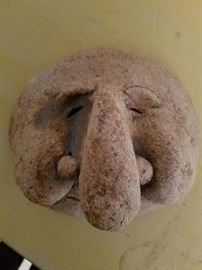Stone face with large nose