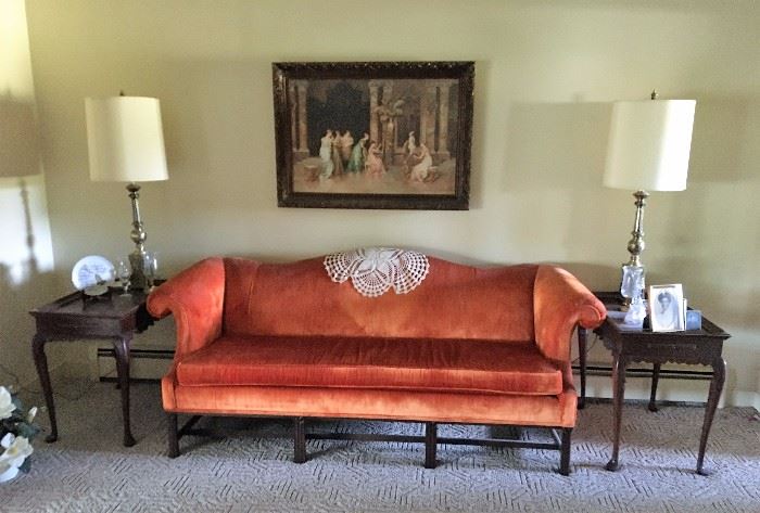 Great orange velvet sofa with matching end tables and lamps.