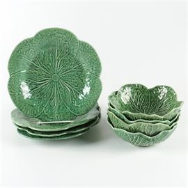 Bordallo Pinheiro Portuguese Cabbage Leaf Tableware: A collection of eight pieces of Bordallo Pinheiro cabbage leaf majolica style tableware. The collection includes four bowls and four plates. Each is marked to the underside with the Bordallo Pinheiro Portugal black maker’s mark.