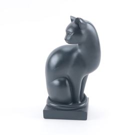 Reproduction Ceramic Sculpture After Heinz Warneke's "Elegance": A reproduction ceramic sculpture after an original work titled Elegance (circa 1927) by well-listed artist, Heinz Warneke. The original marble sculpture is housed at the Smithsonian American Art Museum. This piece features a seated, sleek black cat. It is presented atop a black square base. Affixed to the underside is felt padding and additional information on the original work.