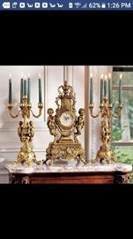 Vintage clock and to candelabras very heavy