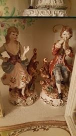 Male and female 24in tall porcelain figurines