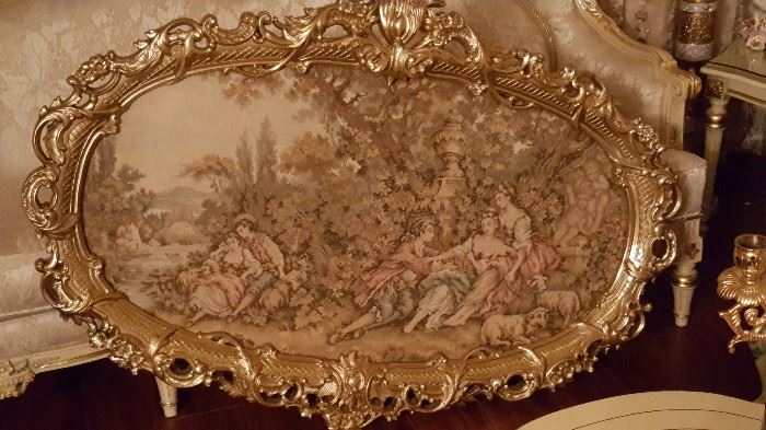 Very large oval tapestry with carved gold frame