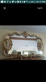 Italian mirror with lovers on each side that is porcelain statues