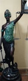 Bronze statue with skill over 5 feet tall