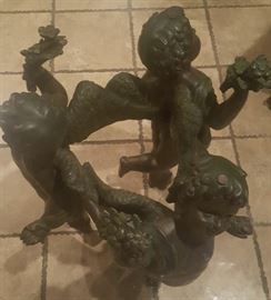 Bronze three cherubs dancing around table