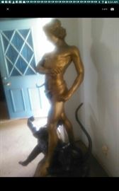 Bronze figurine standing four feet tall