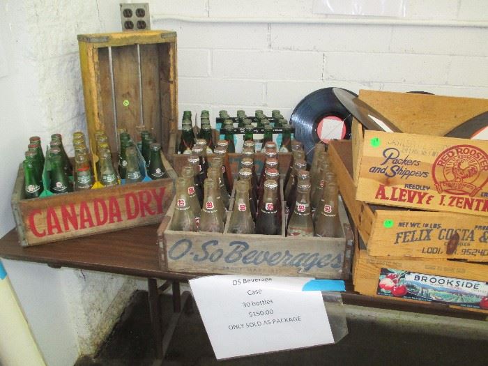 beverage cases O-So beverage, Canada Dry and Cotton Club. Full cases some bottles still with product in them.