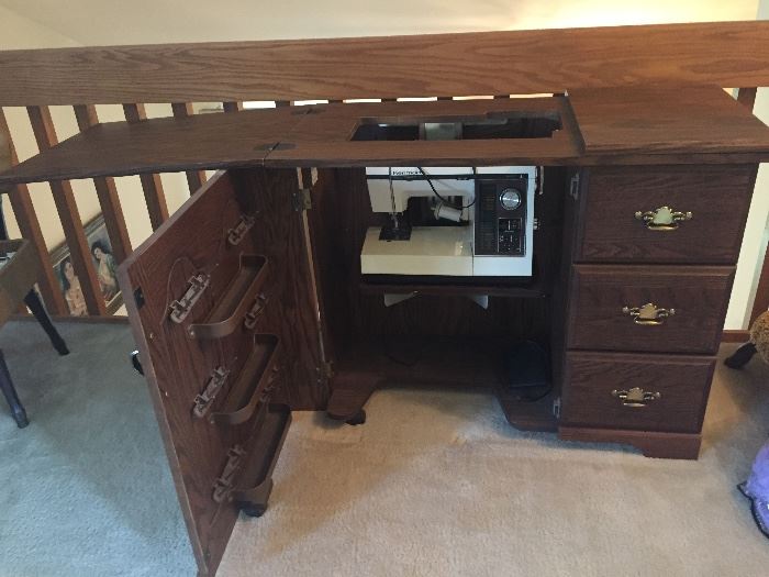 Great sewing machine in cabinet with chair