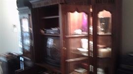 Bad Pic of the entertainment center, filled with beautiful collectibles