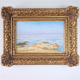 Ben Carre Antique Original Oil on Board "High Tide": An early 20th century original oil painting on board by French artist Ben Carre (1883 – 1978) titled High Tide. The image depicts a golden rocky coastal scene at high tide, the delicate blues and violets of the sky are reflected on the tranquil ocean waves below. The painting is mounted in an ornate gilded, gesso wood frame with hanging wire. Signed to the lower right corner. Written to the verso, Mare Nostrum d’etal Baie de Marseilles 1910.