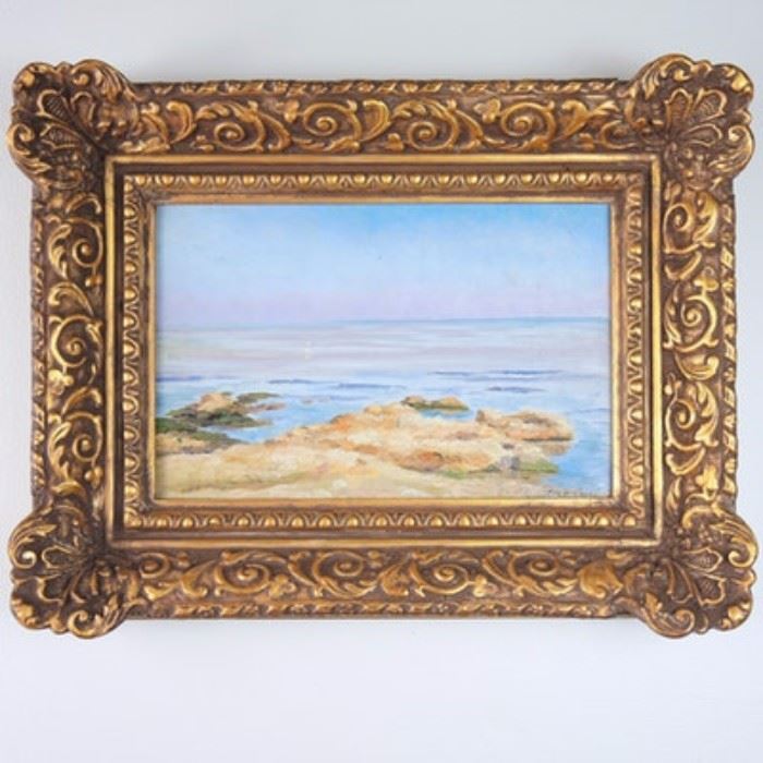 Ben Carre Antique Original Oil on Board "High Tide": An early 20th century original oil painting on board by French artist Ben Carre (1883 – 1978) titled High Tide. The image depicts a golden rocky coastal scene at high tide, the delicate blues and violets of the sky are reflected on the tranquil ocean waves below. The painting is mounted in an ornate gilded, gesso wood frame with hanging wire. Signed to the lower right corner. Written to the verso, Mare Nostrum d’etal Baie de Marseilles 1910.