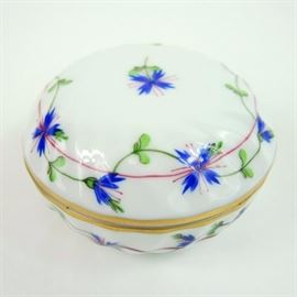 Herend Hand Painted Trinket Box: A Herend hand painted porcelain trinket box. This box features a wispy blue floral pattern, wrapping around the top and bottom, and a gilt rim. The underside of the box bears the Herend name and is marked 6037/PBG K 93. Made in Hungary.