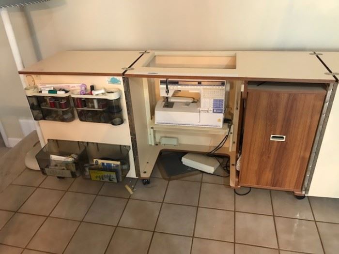 Cabinet is powered to lift the sewing machine
