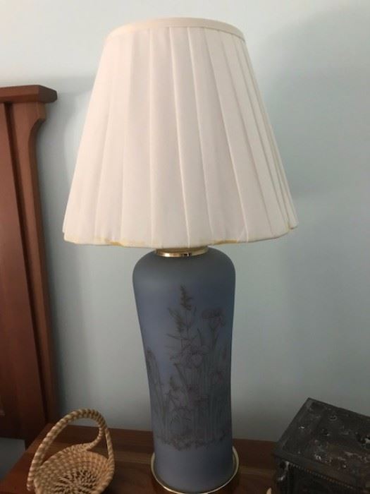 One of two lamps with hand painted base