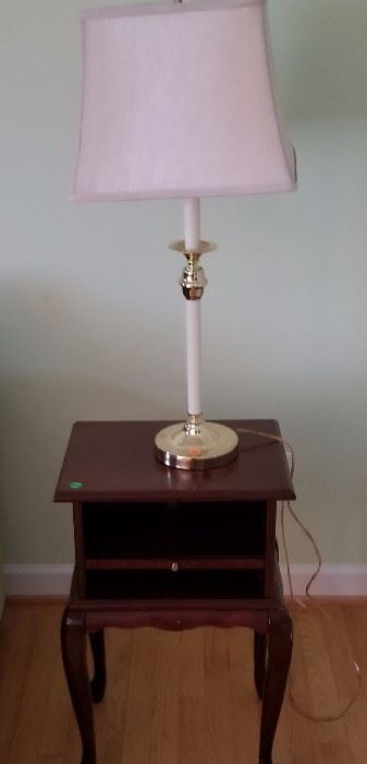 Small mahogany side table with pull-out drawer, sitting on cabriole legs. Asking $28.00, including lamp.